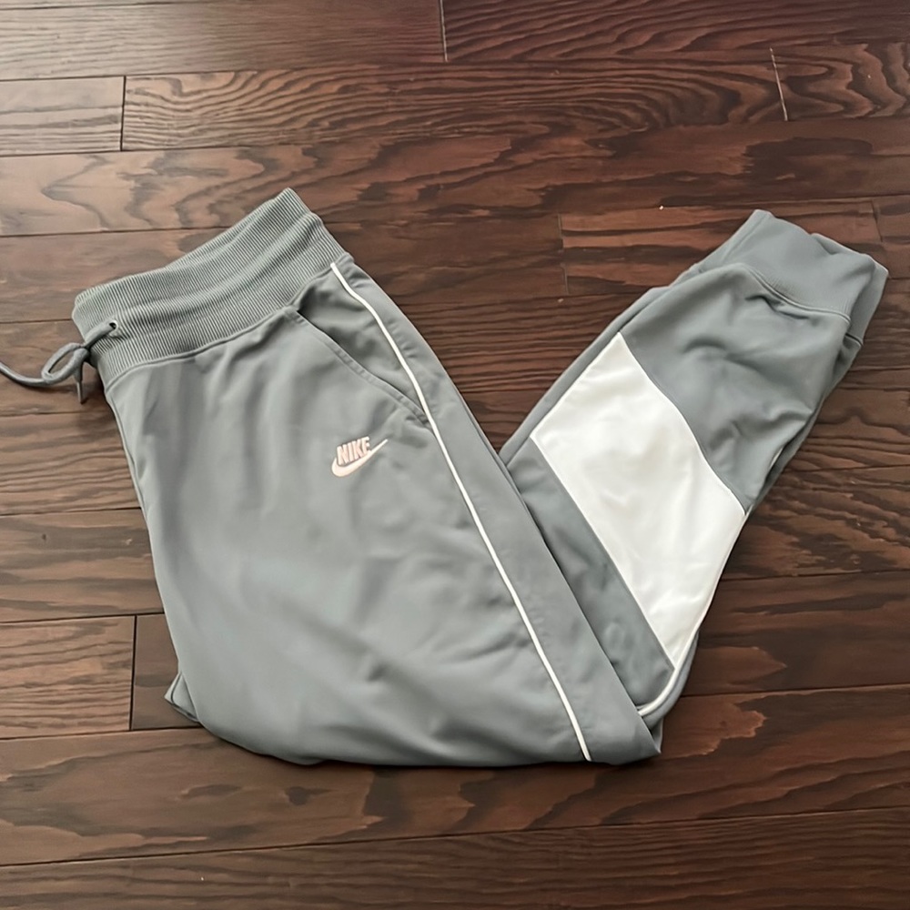 Women’s Nike athletic joggers.  Gray and white detail. Size large.
